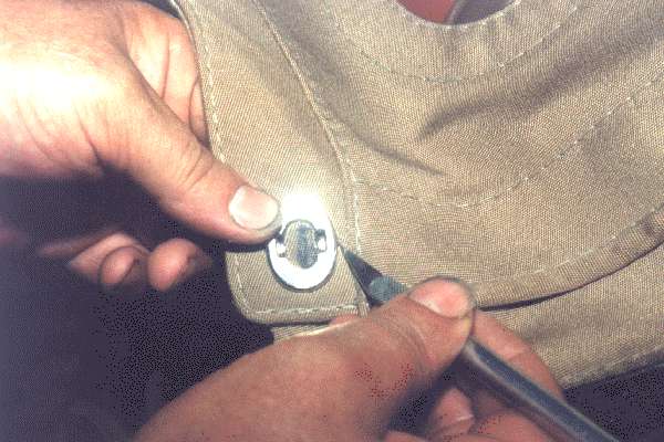 Inserting the eyelet for the turnbutton